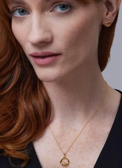 Close up of red haired model wearing 14Ct Gold Vermeil Claddagh Pendant